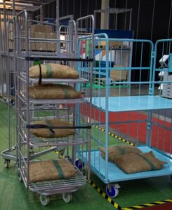 Multiple roll cage trolleys on a warehouse floor