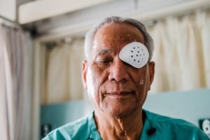 A man with one eye covered after suffering an injury