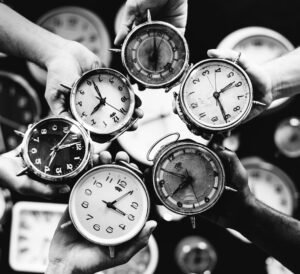 black and white image different types of round clock representing personal injury compensation time limits.