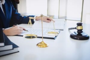 A solicitor reviewing notes on a laser removal burns compensation claim.