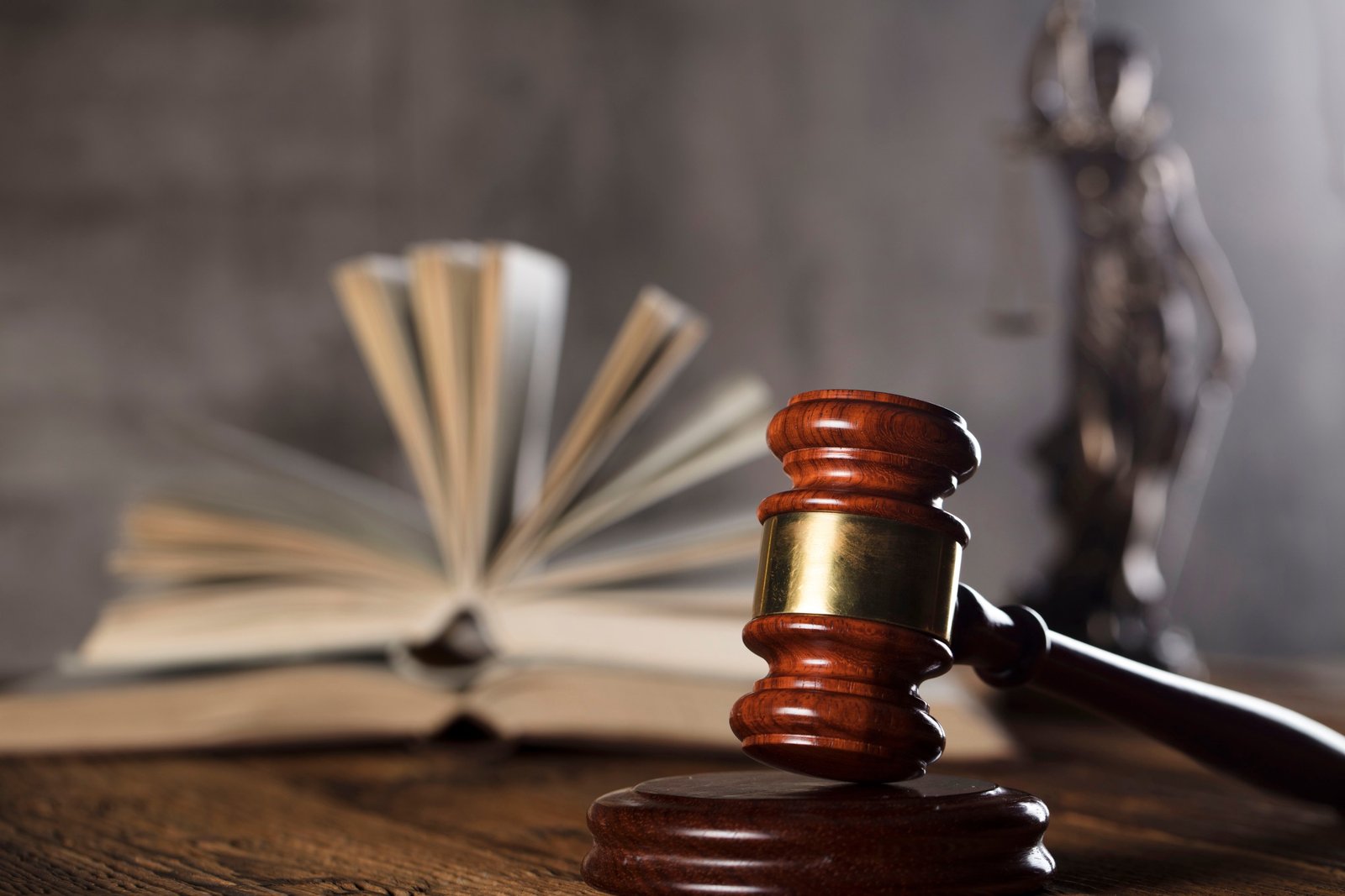 Judge's Gavel In Front Of Book.
