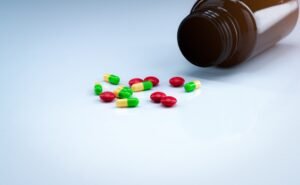 A bottle of pills split on a table