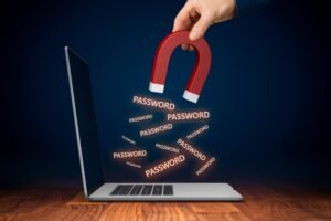 Passwords being stolen from a laptop with a magnet.