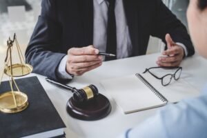 A personal injury solicitor discussing a warehouse accident claim with a client