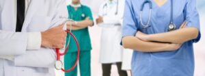 A group of medical professionals in different types of clothing.
