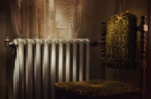 Radiator and chair inside a hotel room to represent our guide on hotel radiator burn