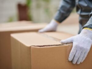 Worker preparing to lift a box
