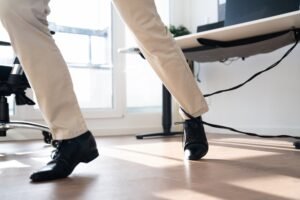 A person trips over a wire behind a desk. and will claim loss of amenity compensation