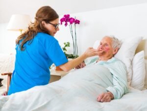 An elderly woman receiving care in a hospital after suffering food poisoning