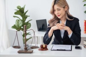 A personal injury solicitor who is an expert in botox injury claims sits at a desk.
