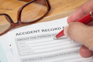 A person completing legal expenses insurance documents as part of their claim