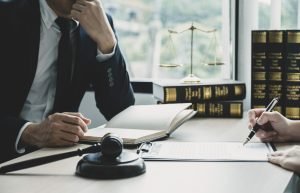 A dermal filler injury claims solicitor talking to a client