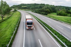 A HGV driving down an empty motorway