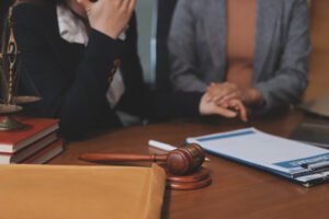 A lawyer explains the process of making fatal accident at work claims with a client