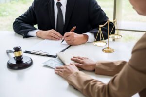 A solicitor sat talking about Sainsbury's injury claims with a client.
