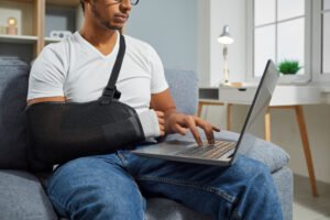 A man researches treatment options for a missed fracture in his arm