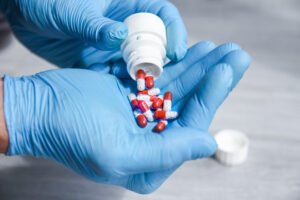 A healthcare professional is dispensing medication