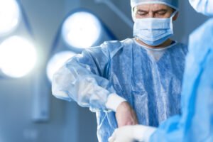 A consultant orthopaedic surgeon is performing spinal surgery