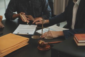 A specialist medical negligence solicitor with justice scales helps clients with clinical negligence claims