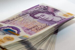 A close-up shot of a stack of £20 notes to represent the compensation that can be won in a successful paramedic negligence claim. 