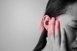 A woman experiences pain in her face after receiving a substandard cosmetic procedure