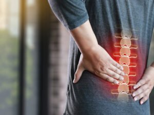 A man is suffering back pain due to kidney damage 