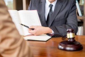 Solicitor explaining hairline fracture compensation claims to a client.