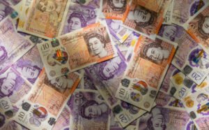 Compensation for an accident on a zebra crossing spread out on a flat surface consisting of ten and twenty pound notes. 