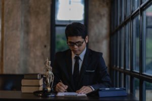 Hotel accident claims solicitor handling a claim at his desk