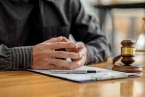 A solicitor explaining how to make an NHS accident at work claim to their client